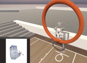 Participant navigates quadcopter through a hoop through decoded finger movements.